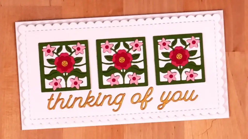 A card with flowers on it and the words thinking of you.