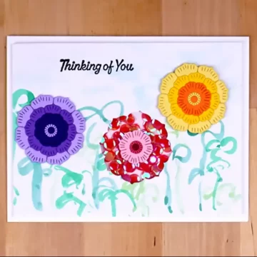 A pretty posey shaker card with the words thinking of you.