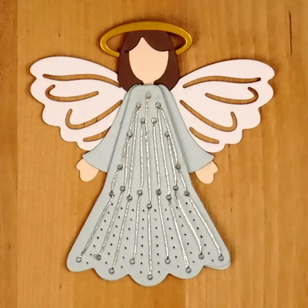 The die-cut angel that sits on the top of the Stitchmas Christmas Tree Card.
