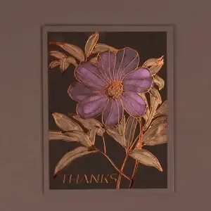 A thank you card with a purple flower on it.