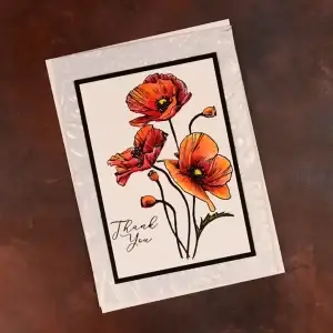 A card with poppy flowers on it.