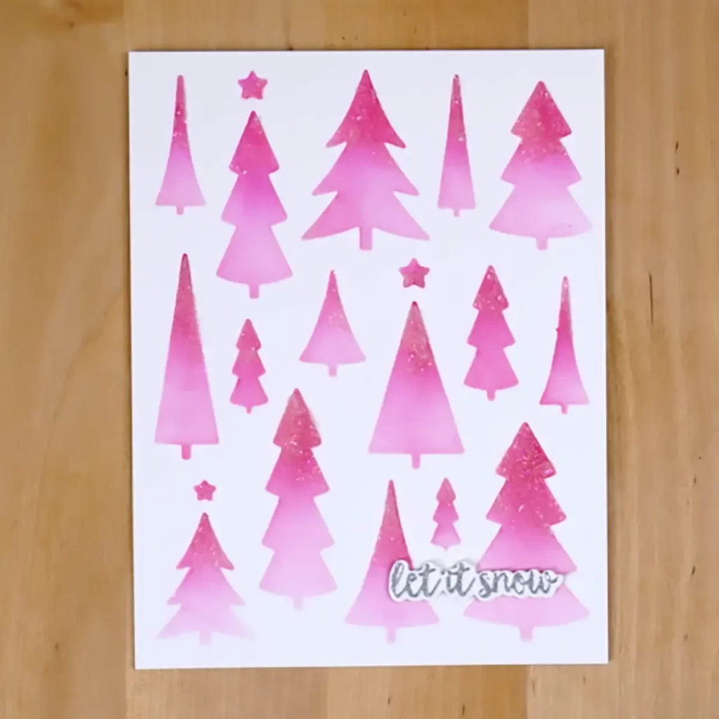 A festive card adorned with pink trees and stars, perfect for counting down to Christmas.