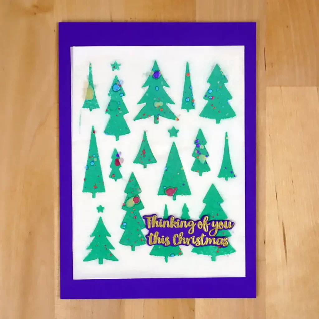 A purple card with Christmas trees on it, perfect for the countdown to Christmas.