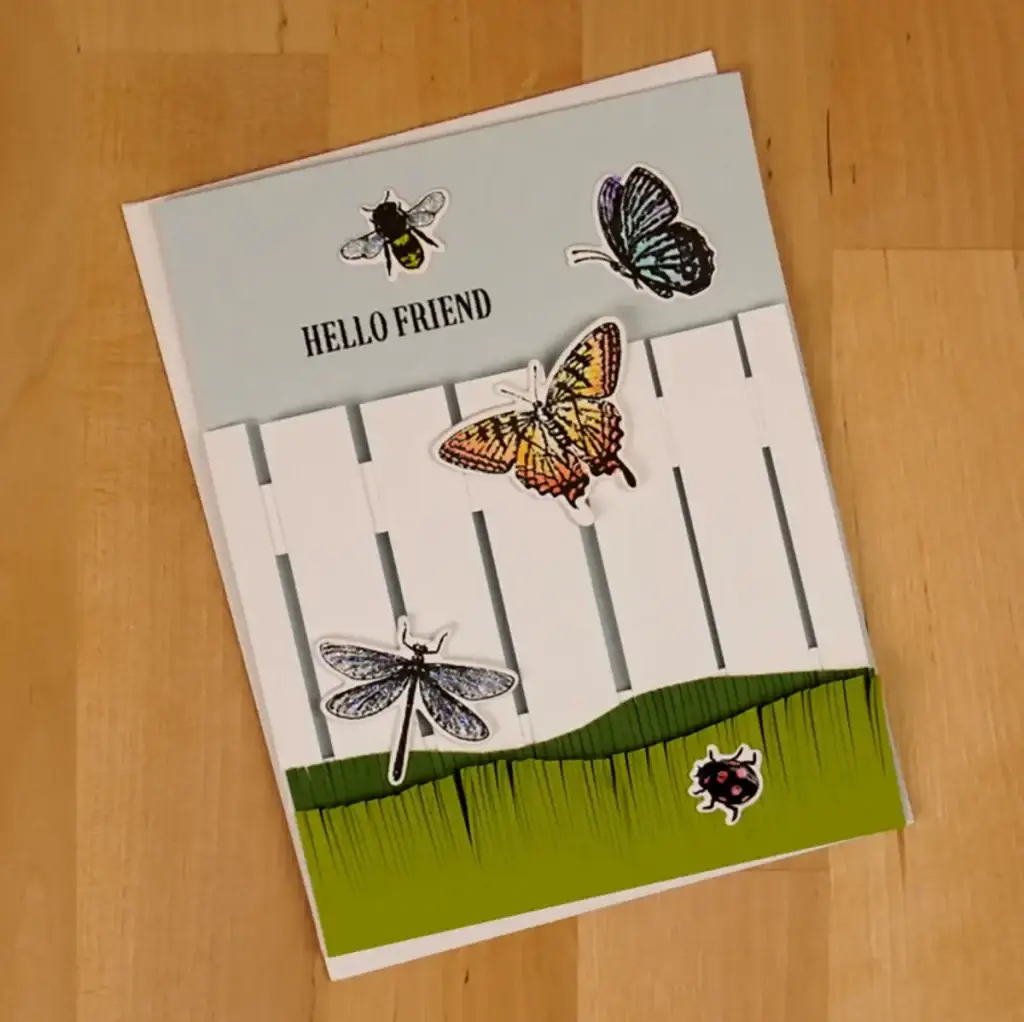 Hello friend card with butterflies and a fence.