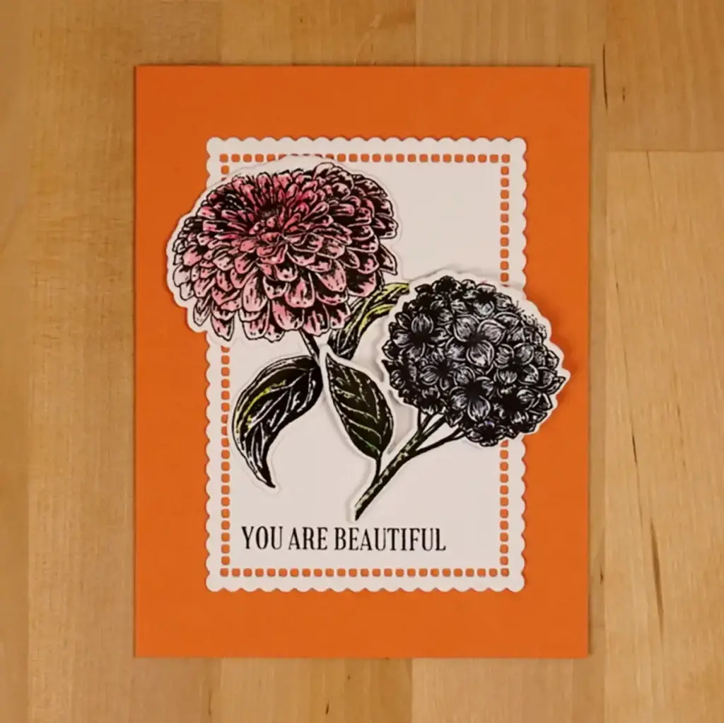 A card with two flowers and the words you're beautiful.