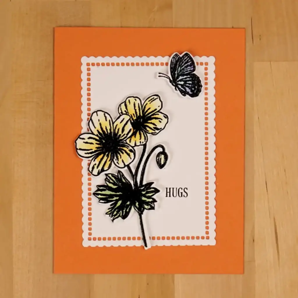 An orange card with yellow Beautiful Blooms flowers and a butterfly.