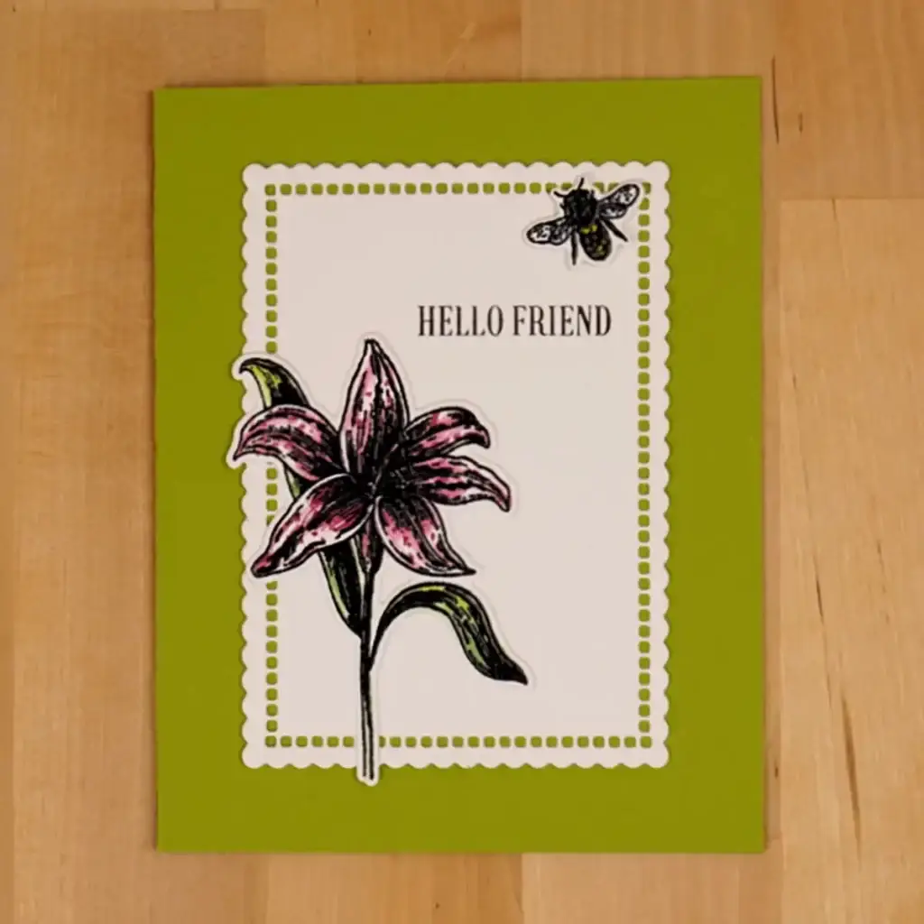 A card with a lily and a bee on it.