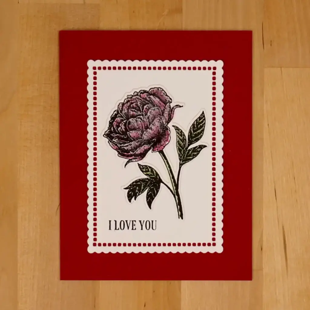 An i love you card with a rose on it.