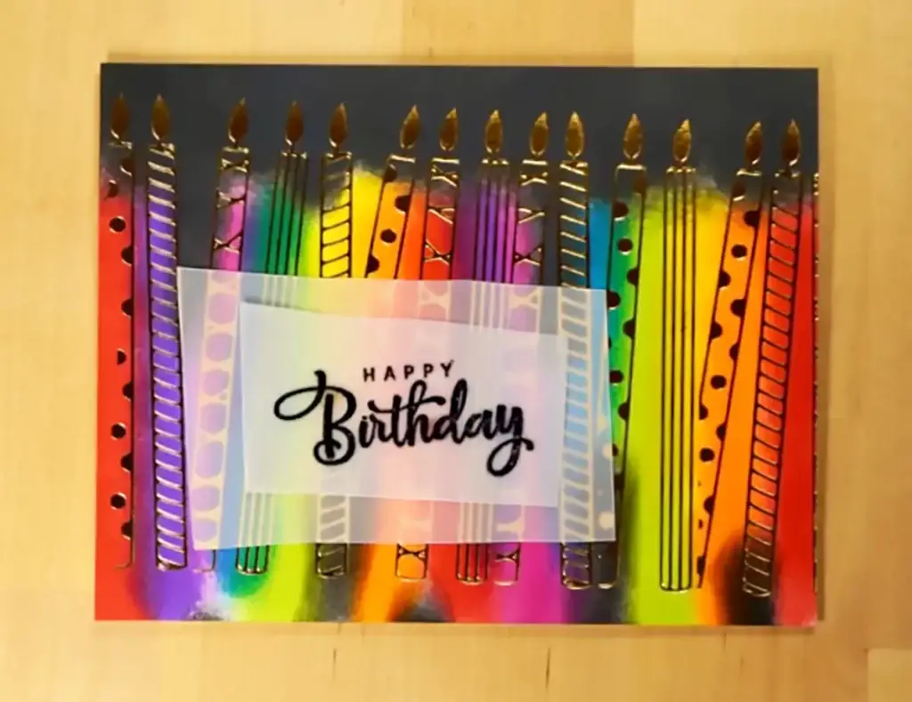 A birthday card featuring colorful candles from Spellbinders' New Release.