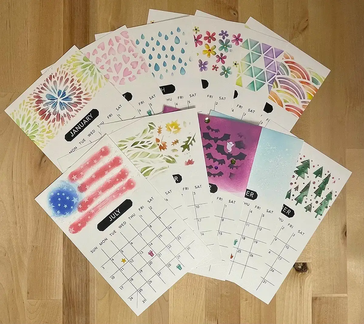 A set of colorful calendars on a wooden table, perfect for gifts.