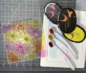 A set of Crafters stamps and brushes on a cutting board.