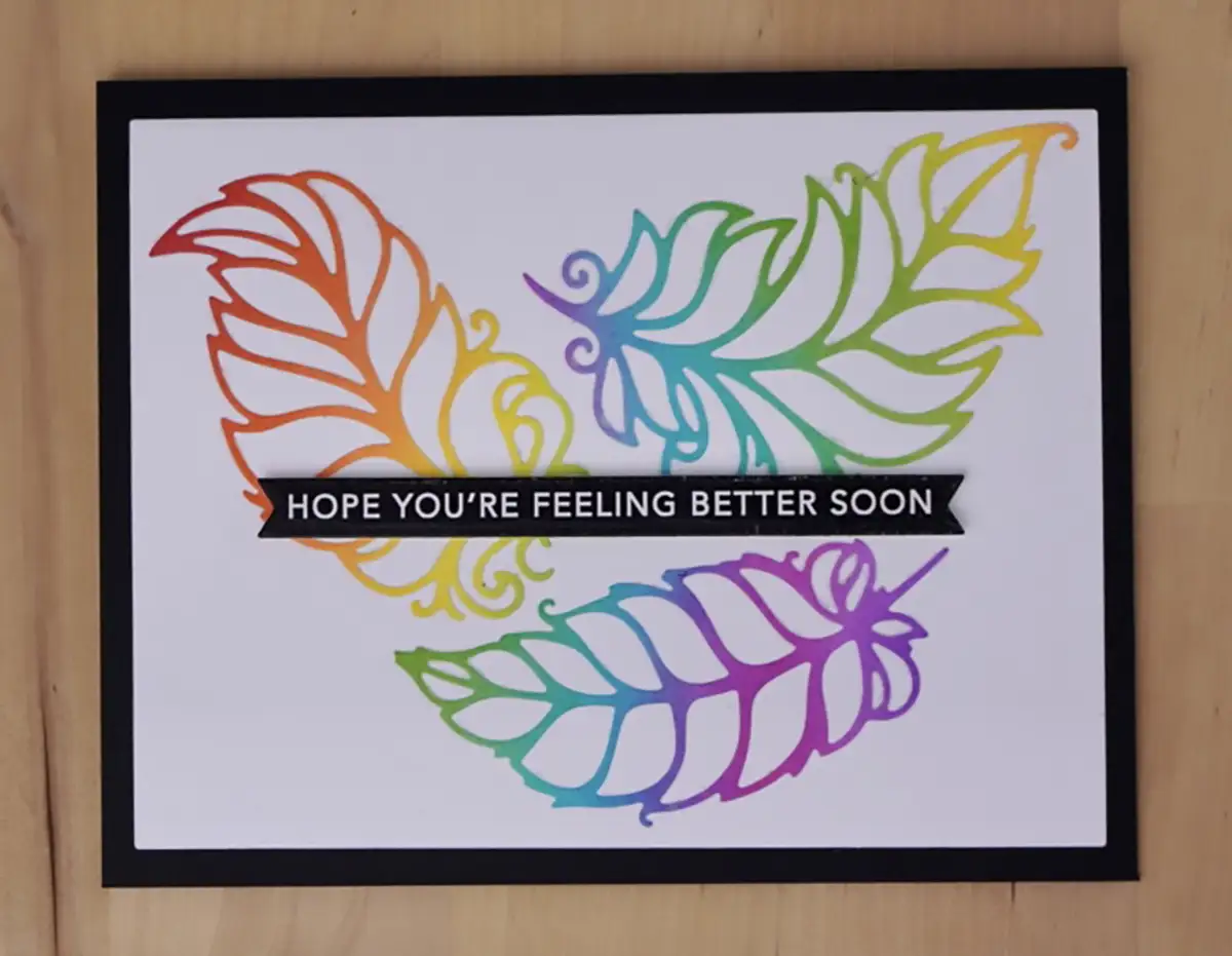 A rainbow colored card featuring the words "hope you're feeling better soon", created from a single die-cut.
