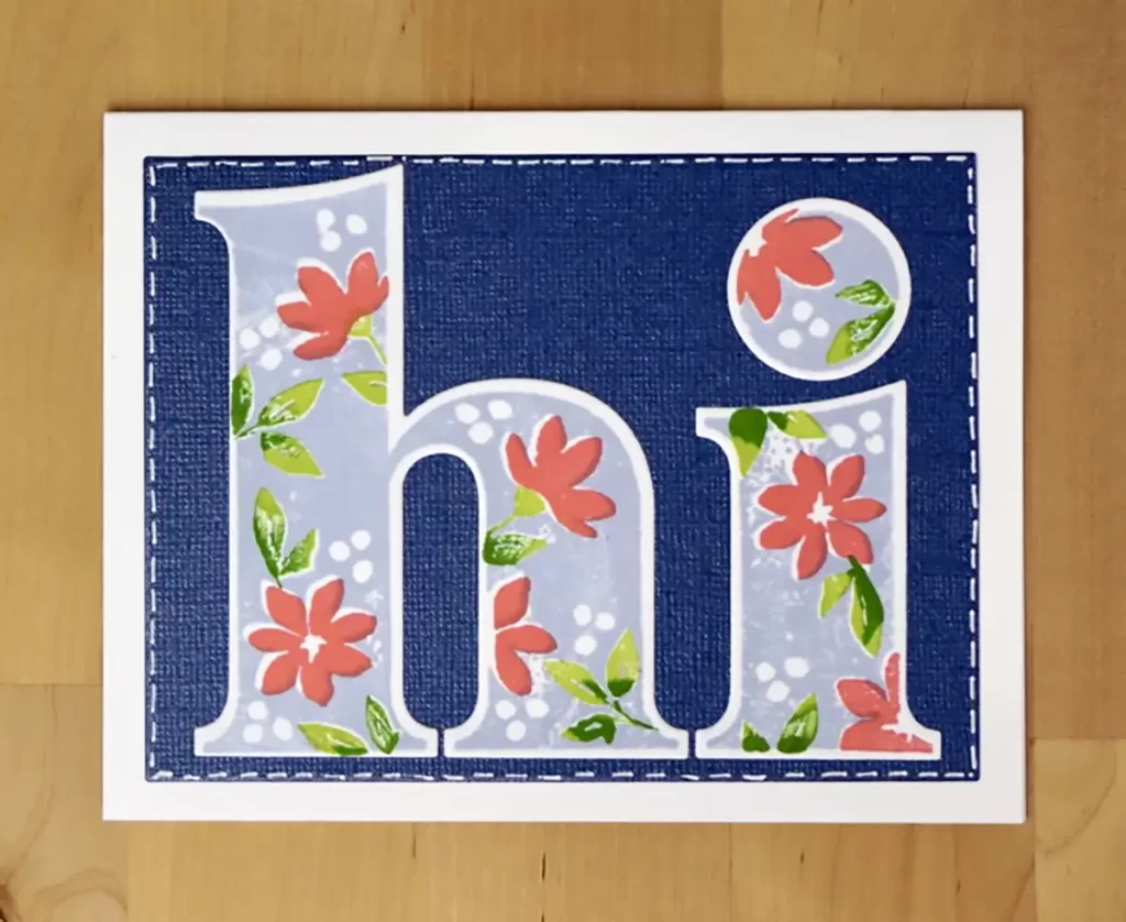 A hi card with the letter h and flowers on it.