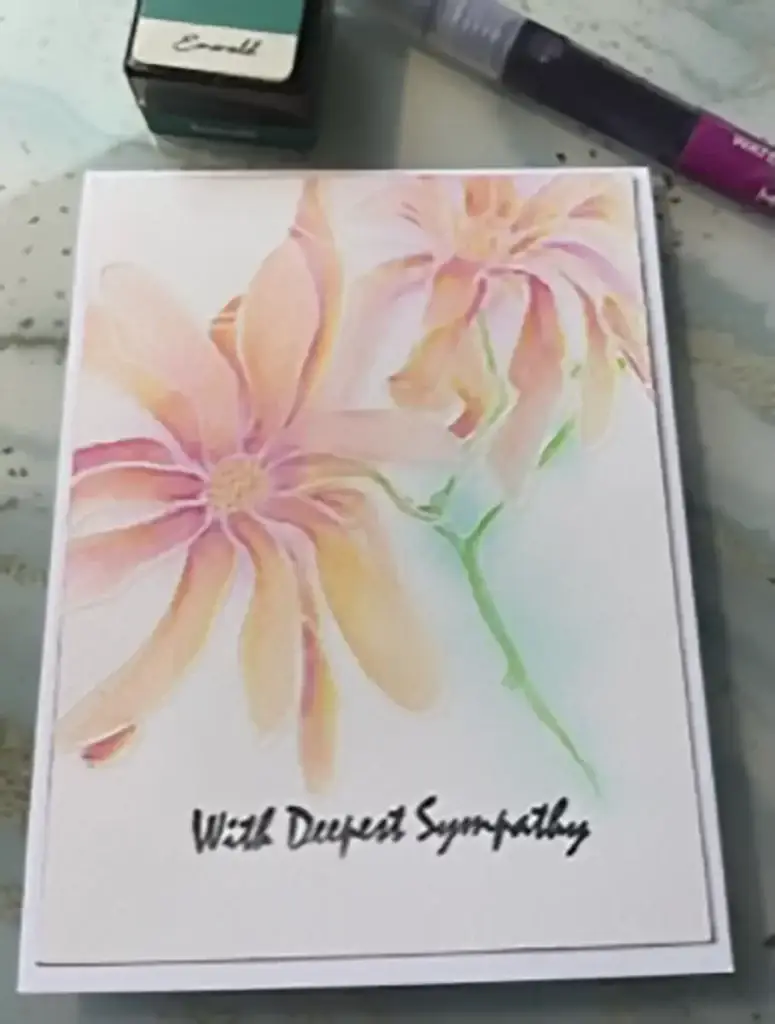 An artistic card featuring a watercolor flower design, showcasing one of the 4 ways to watercolor.