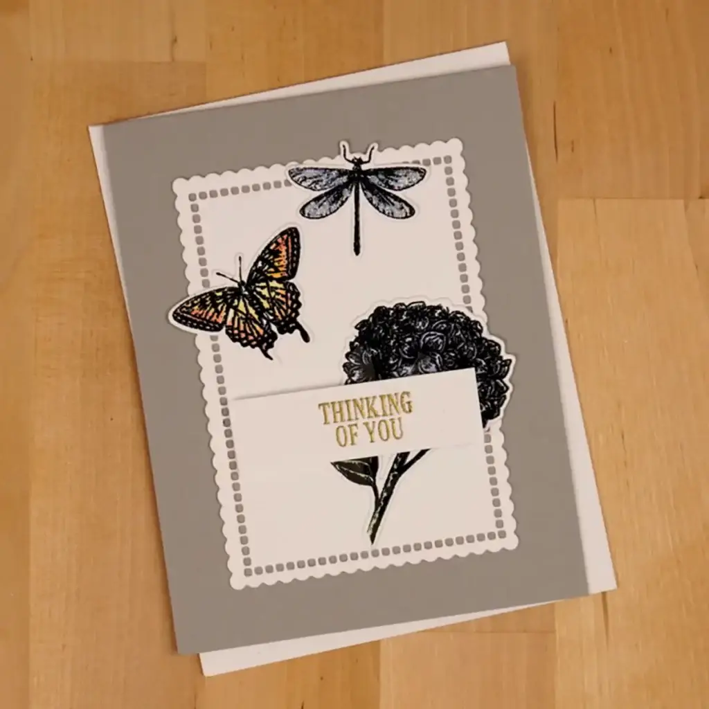 A card with Beautiful Blooms butterflies and flowers on it.