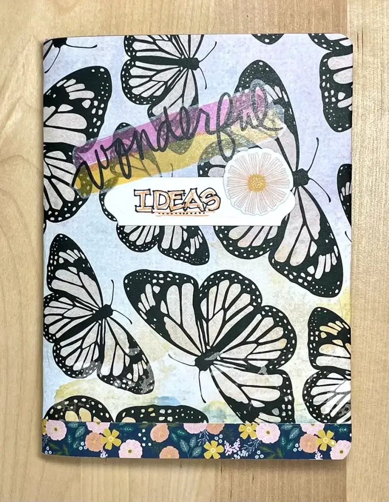 Crafters Traveler's Notebook adorned with butterflies and flowers.
