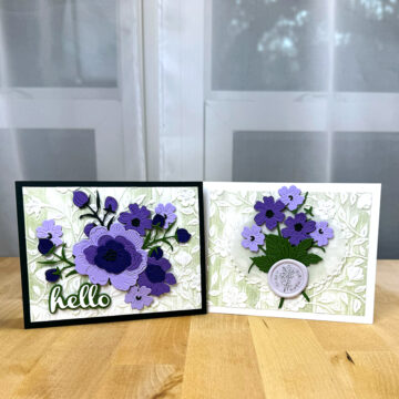 Two floral greeting cards with purple flowers on them.