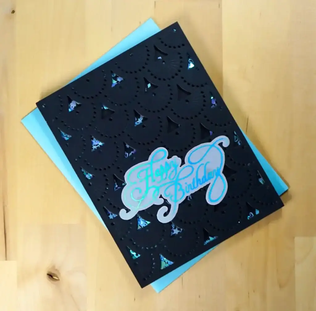 A black and blue card with the word happy birthday on it from Spellbinders' New Release.