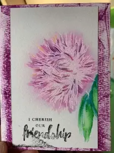 An artistic card featuring a vibrant purple flower created using watercolor techniques.