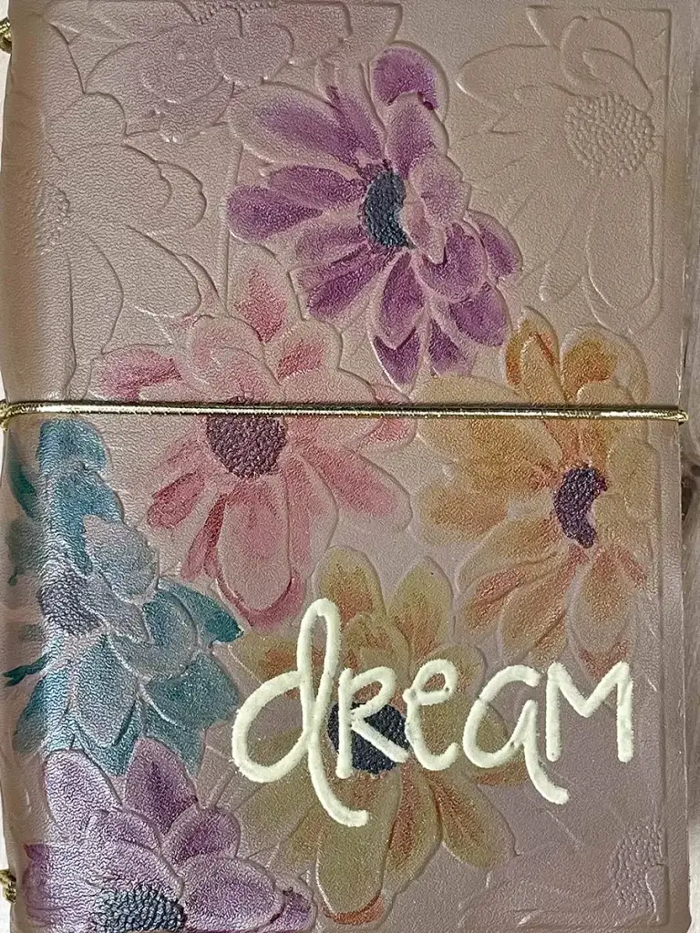 A Crafters Traveler's Notebook with the word dream written on it.