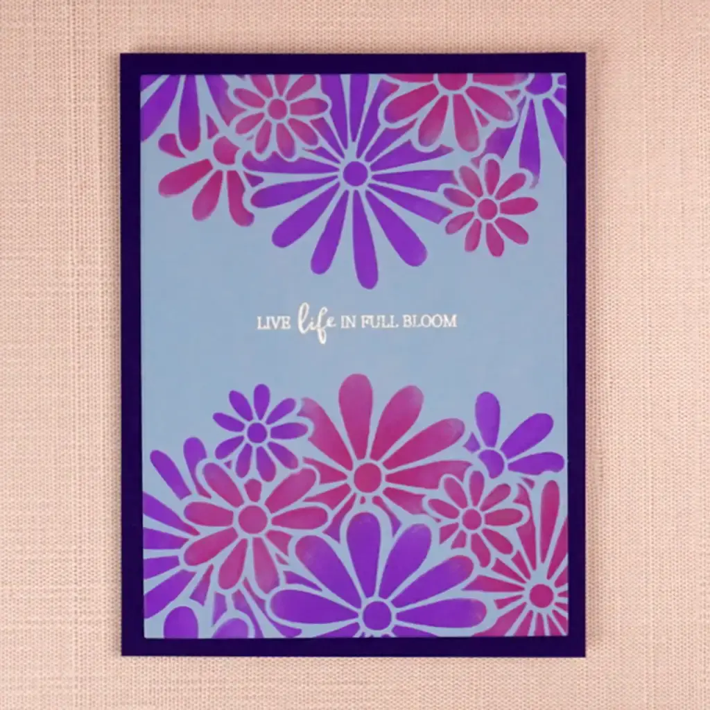 A card with purple and pink flowers on it.