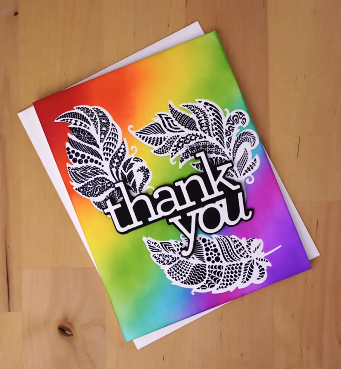 A thank you card with feathers on it, created using the innovative technique of 3 Cards From 1 Die-cut.