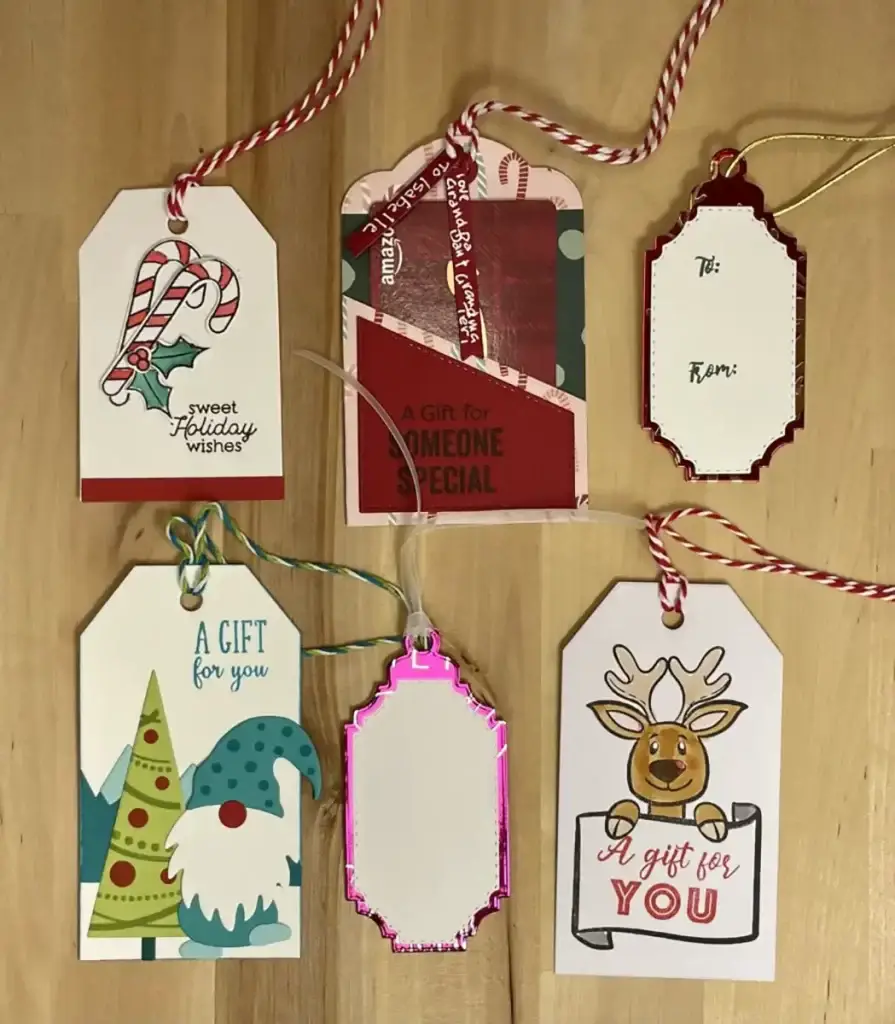 A set of gift tags on a wooden table.