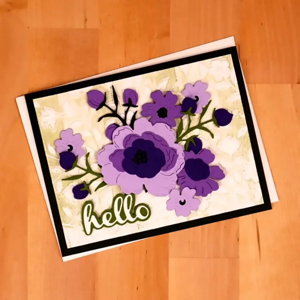 A purple and black floral greeting card with the word hello on it.