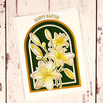 An Easter card with lilies on a wooden background created with Lily Arch, the newest monthly clear stamp & die set.