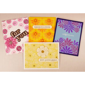 Four greeting cards with flowers on them.