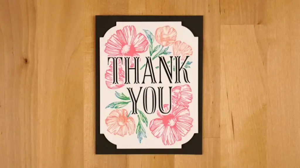 A thank you card with flowers on it.