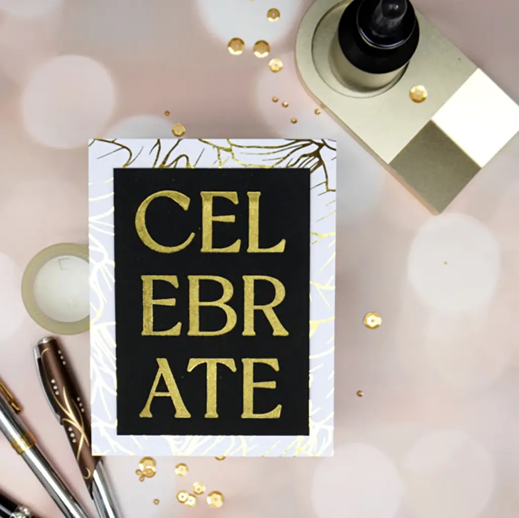 Elegant Handmade Let's Celebrate Greeting card featuring "Celebrate" in gold made with the Celebration Flowers registration plate from the new Spellbinders release.