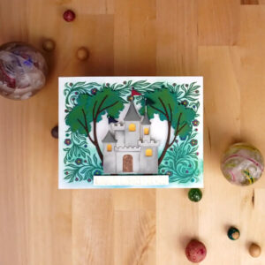 Whimsical Greeting Card with a castle in a Betterpress printed forest.