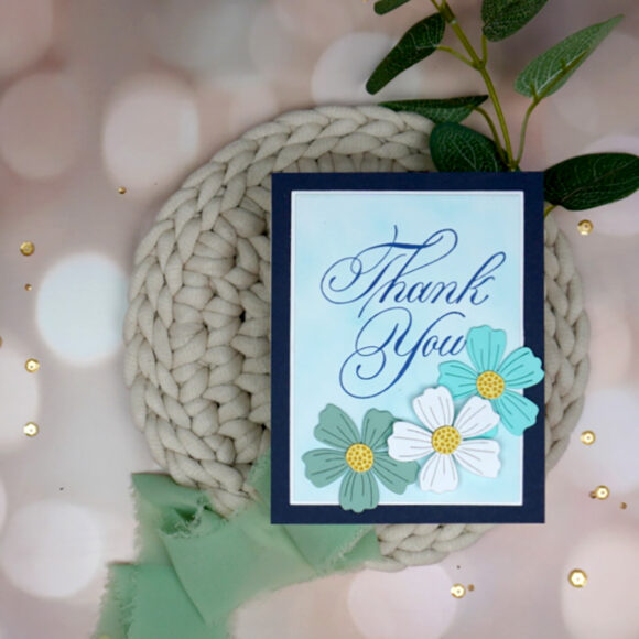 Handmade Copperplate Thank You card with die-cut flowers on it.
