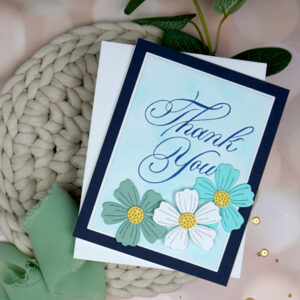 Handmade Copperplate Thank You card with die-cut flowers on it.