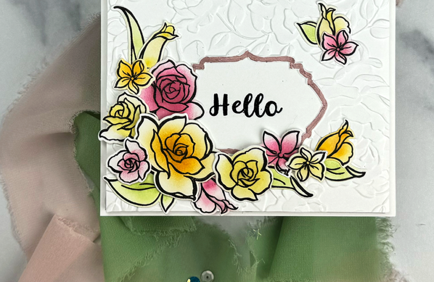You can ink-blend floral stamps to create a beautiful "Hello" card like this. It's got multi-color flowers that accent a pretty framed Hello sentiment.