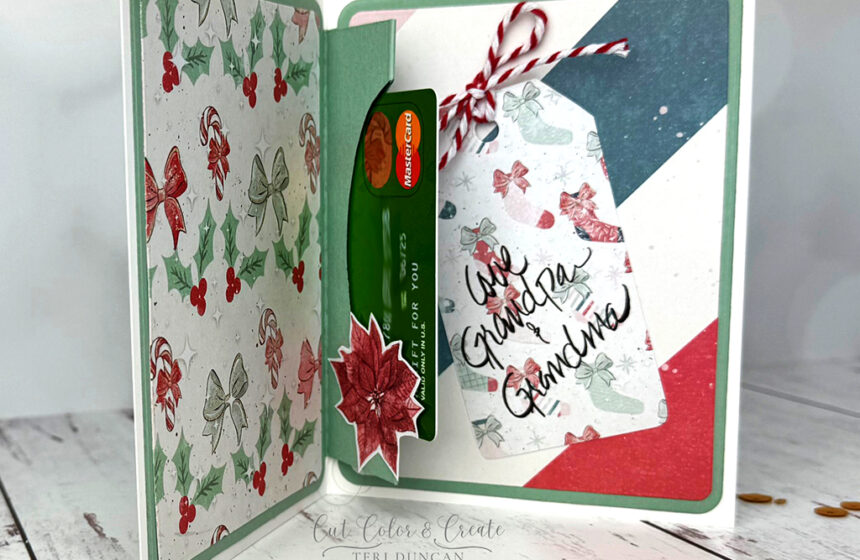 Fun handmade card Christmas card with a surprise inside thanks to the A2 Gift Card Holder dies we used to make the card.