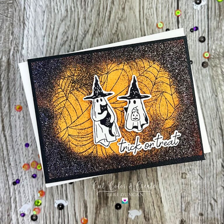 Spooky Halloween card with two ghosts with black hats on and a sentiment from Spellbinders All Seasons Autumn.