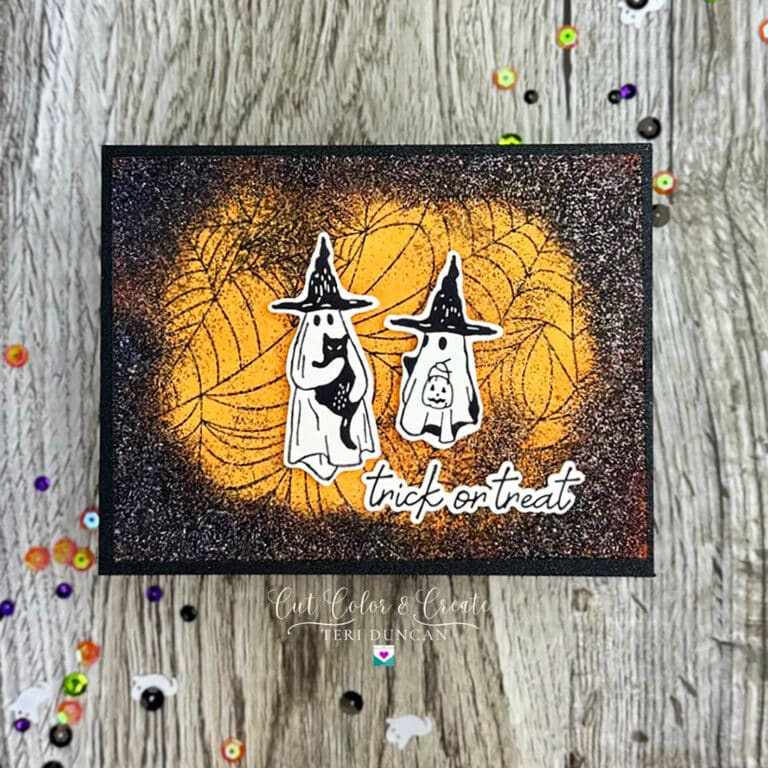 Spooky Halloween card with two ghosts with black hats on and a sentiment from Spellbinders All Seasons Autumn.