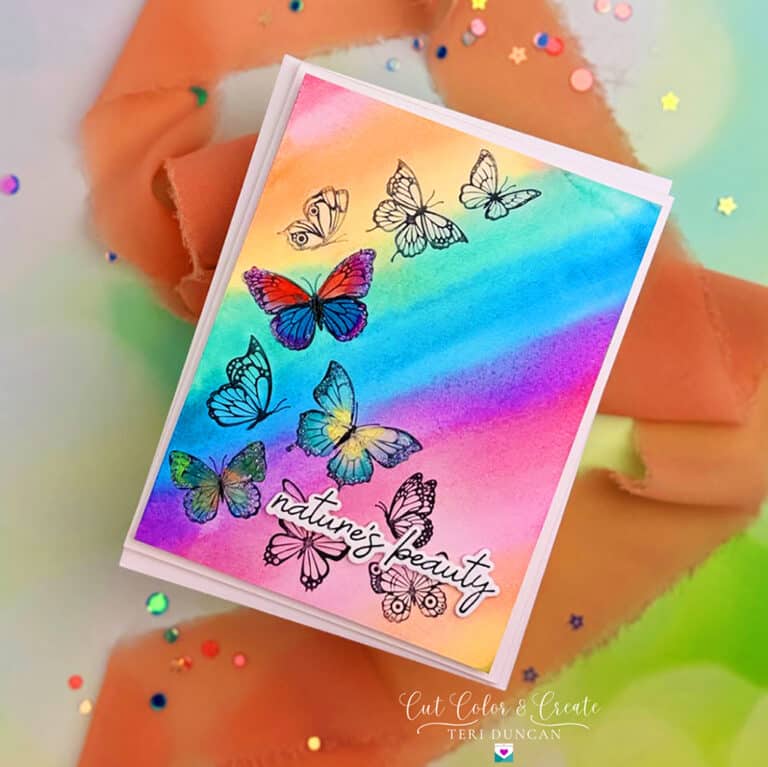 Colorful spring card with a spray of butterflies created using All Season's Spring Betterpress plates for the sentiment.