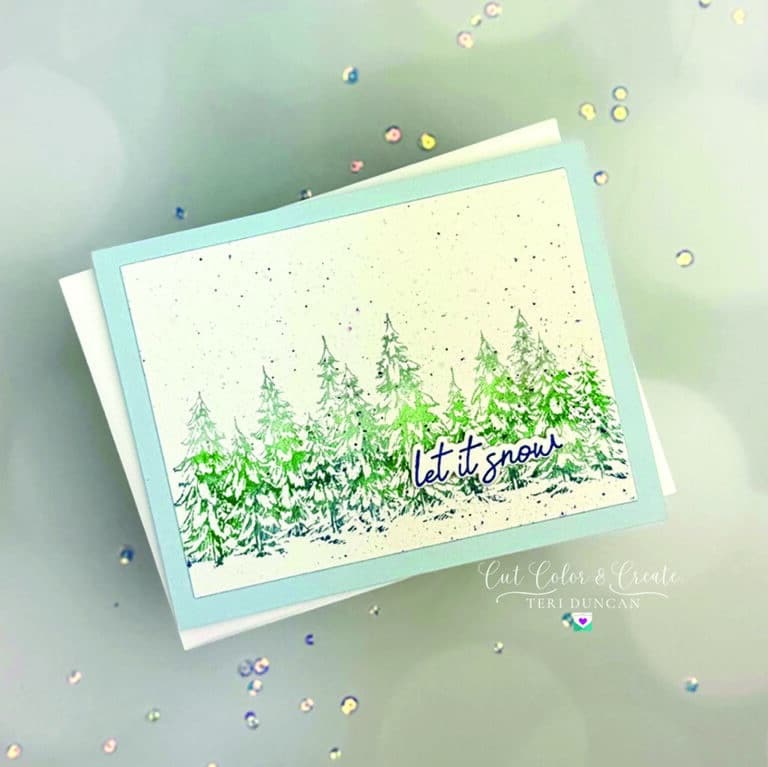 Snowy winter card with evergreens stretching across it and featuring "Let it Snow" from Spellbinders All Seasons Winter press plate set.