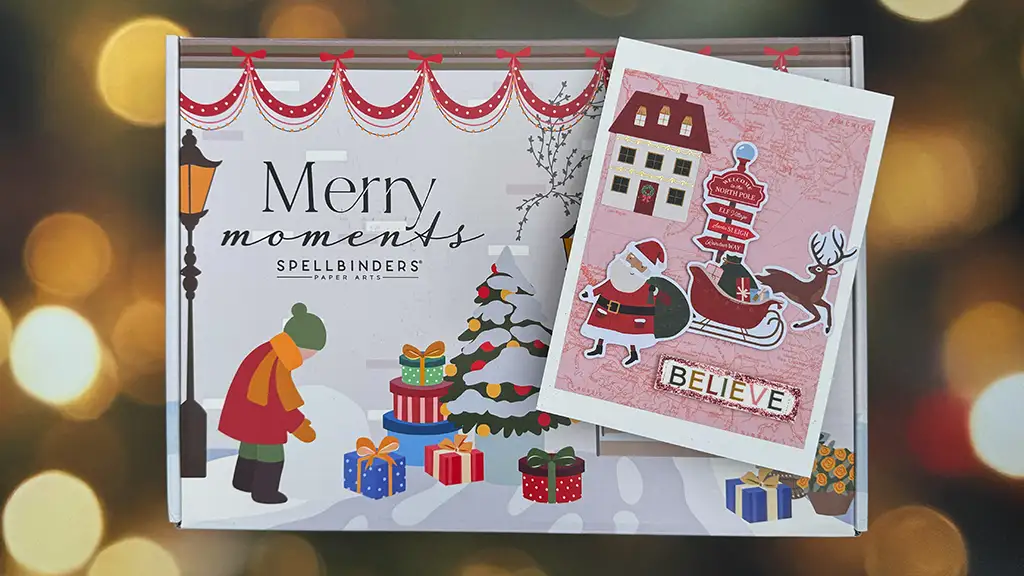 A holiday-themed Spellbinders Christmas Cardmaking Kit box with "Merry Moments" text, a decorated tree, presents, and a card featuring Santa in his sleigh and the word "BELIEVE"—perfect for creating festive Holiday Cards.